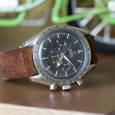 speedmaster broad arrow on strap.